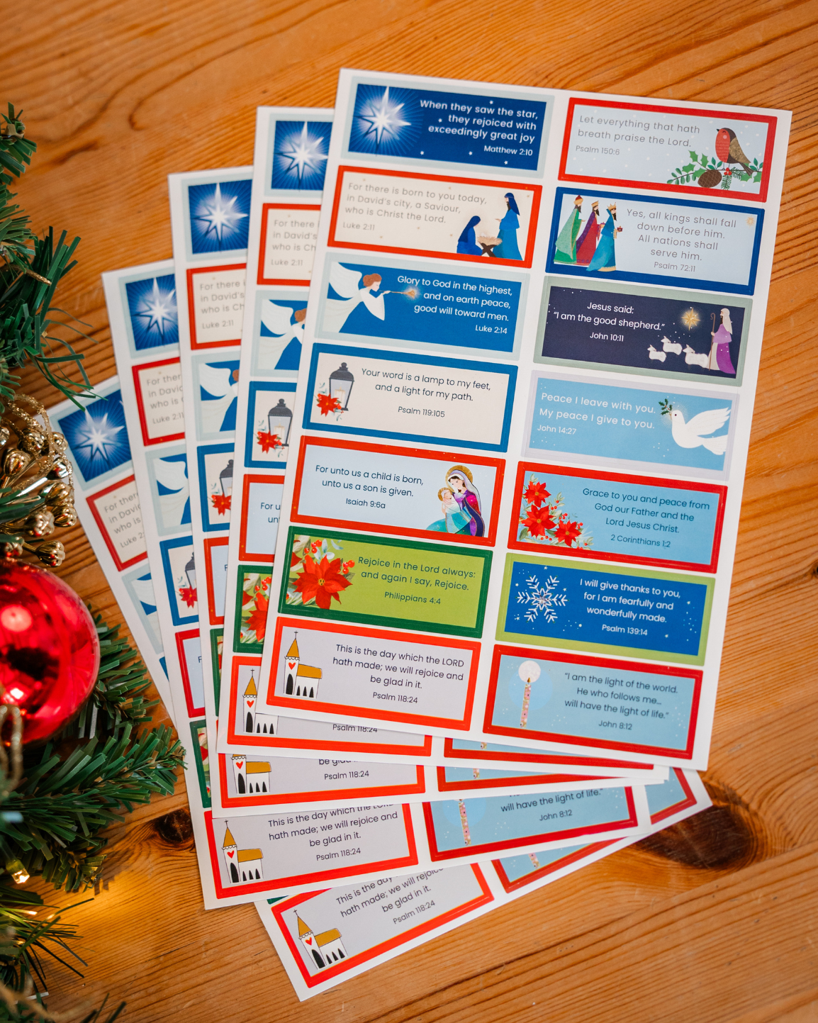 Sheets of Christmas Bible verse stickers with festive imagery
