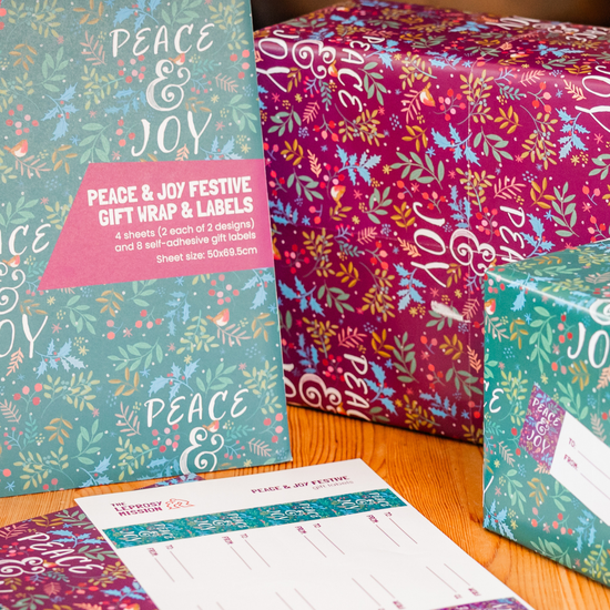 Peace and Joy festive gift wrap sheets with coordinating gift tags