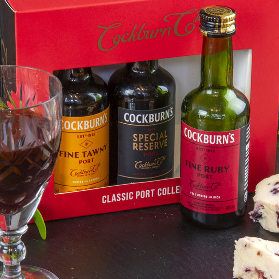 Three miniature bottles of Cockburn's classic port varieties