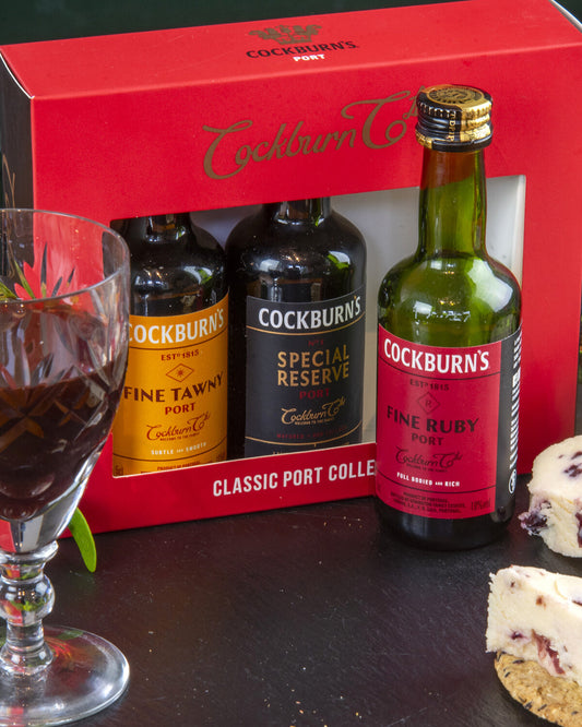 Three miniature bottles of Cockburn's classic port varieties