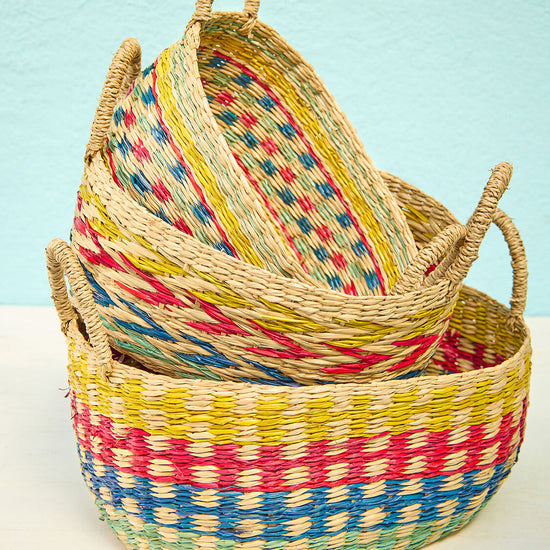 Set of three nesting seagrass baskets with rainbow design and handles, Fair Trade