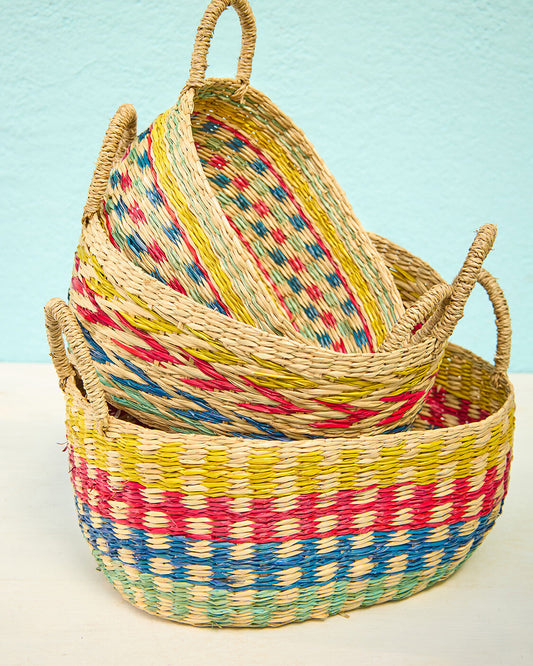 Set of three nesting seagrass baskets with rainbow design and handles, Fair Trade